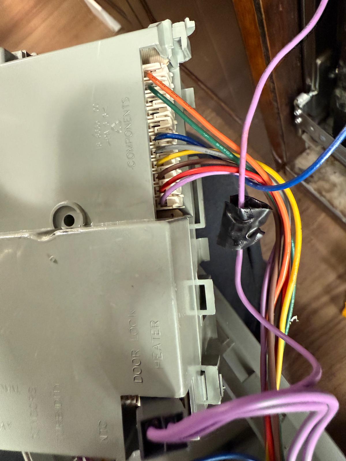 Appliance control housing with multiple colored wires and connectors