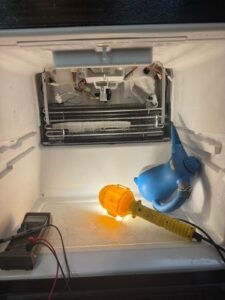 Freezer evaporator area during defrost repair and cleaning