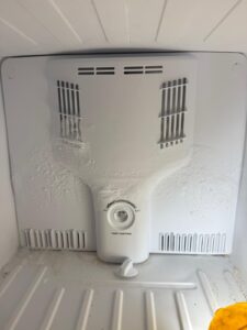 Freezer evaporator cover with frost buildup during diagnosis