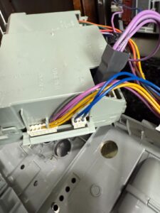 Washer control module wiring harness during service